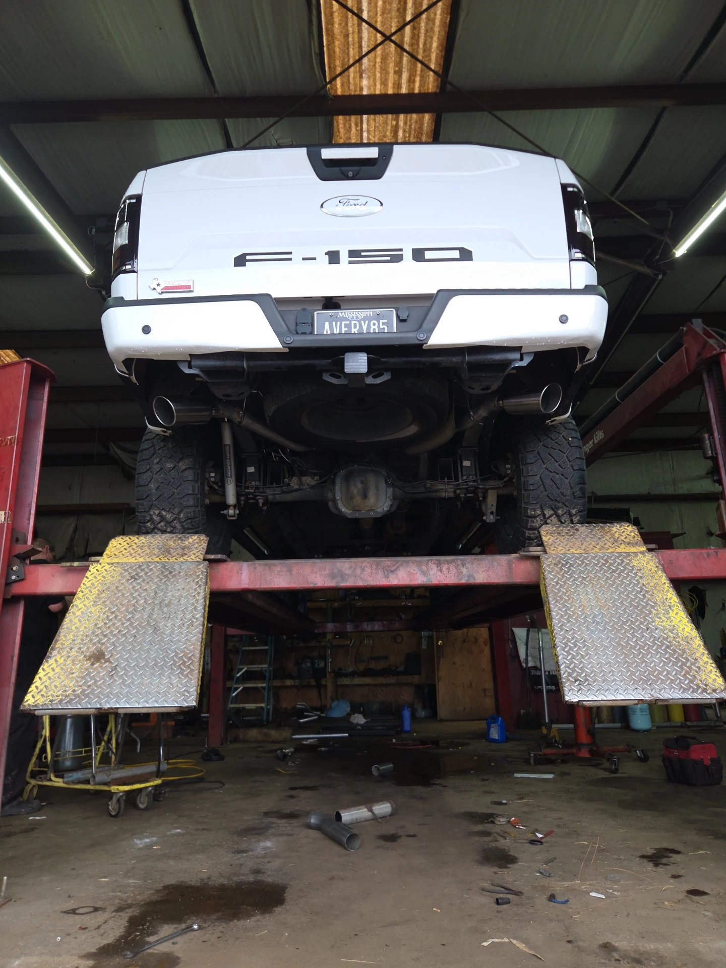 Ford F-150 on the lift for exhaust work